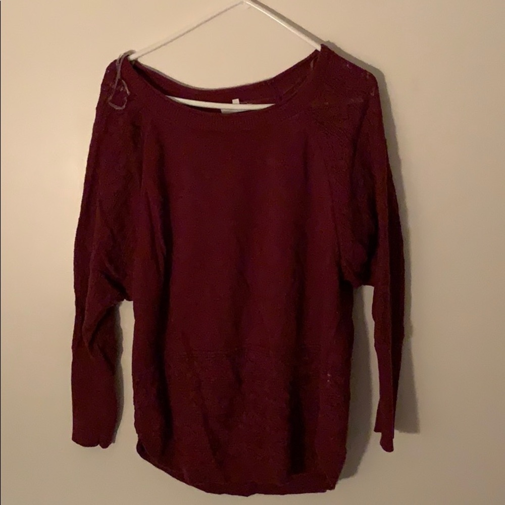 Burgundy sweater with lace-like detailing